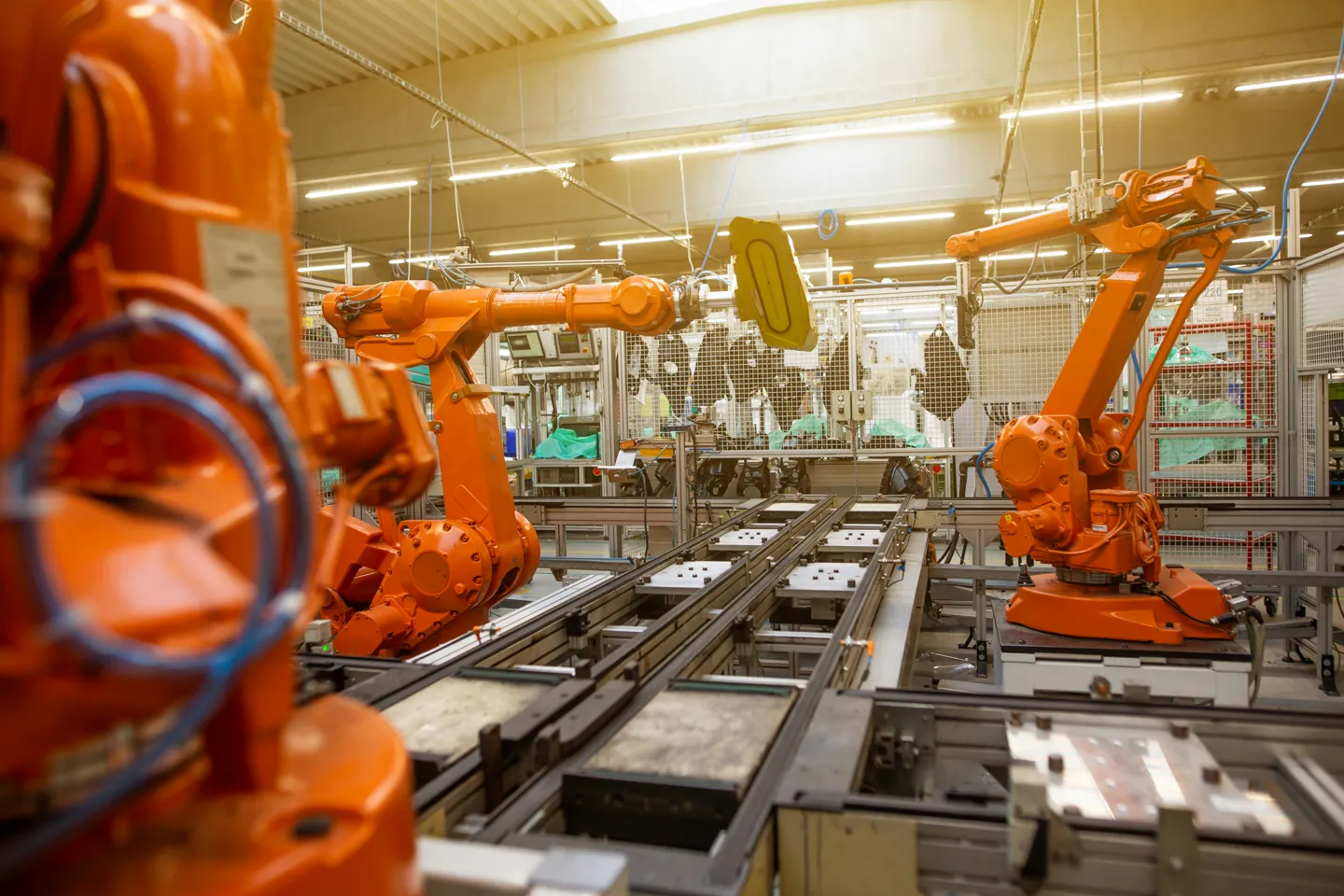 Industrial robots operating along an automated production line